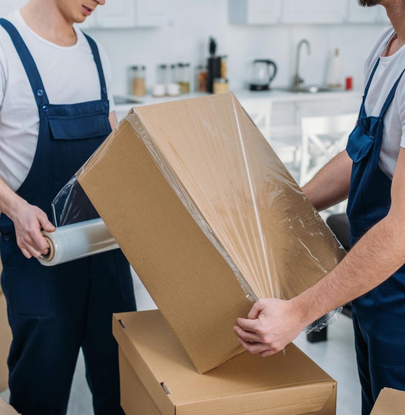 Professional local movers near me in Katy, TX loading boxes and household belongings