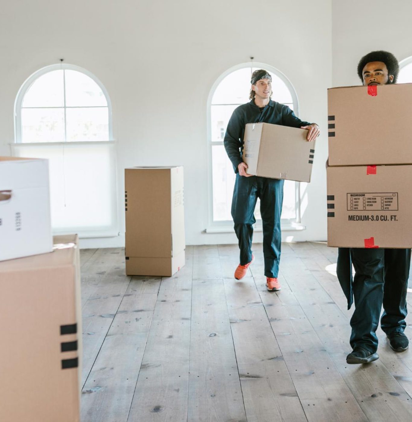 Professional movers near me in Brazoria County, TX packing boxes efficiently