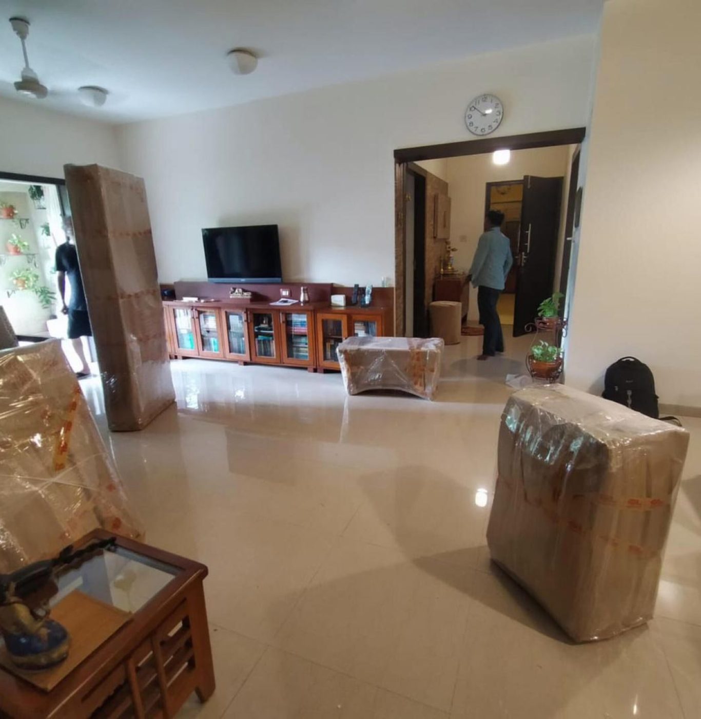 Professional movers near me in Katy, TX packing boxes and household items safely.