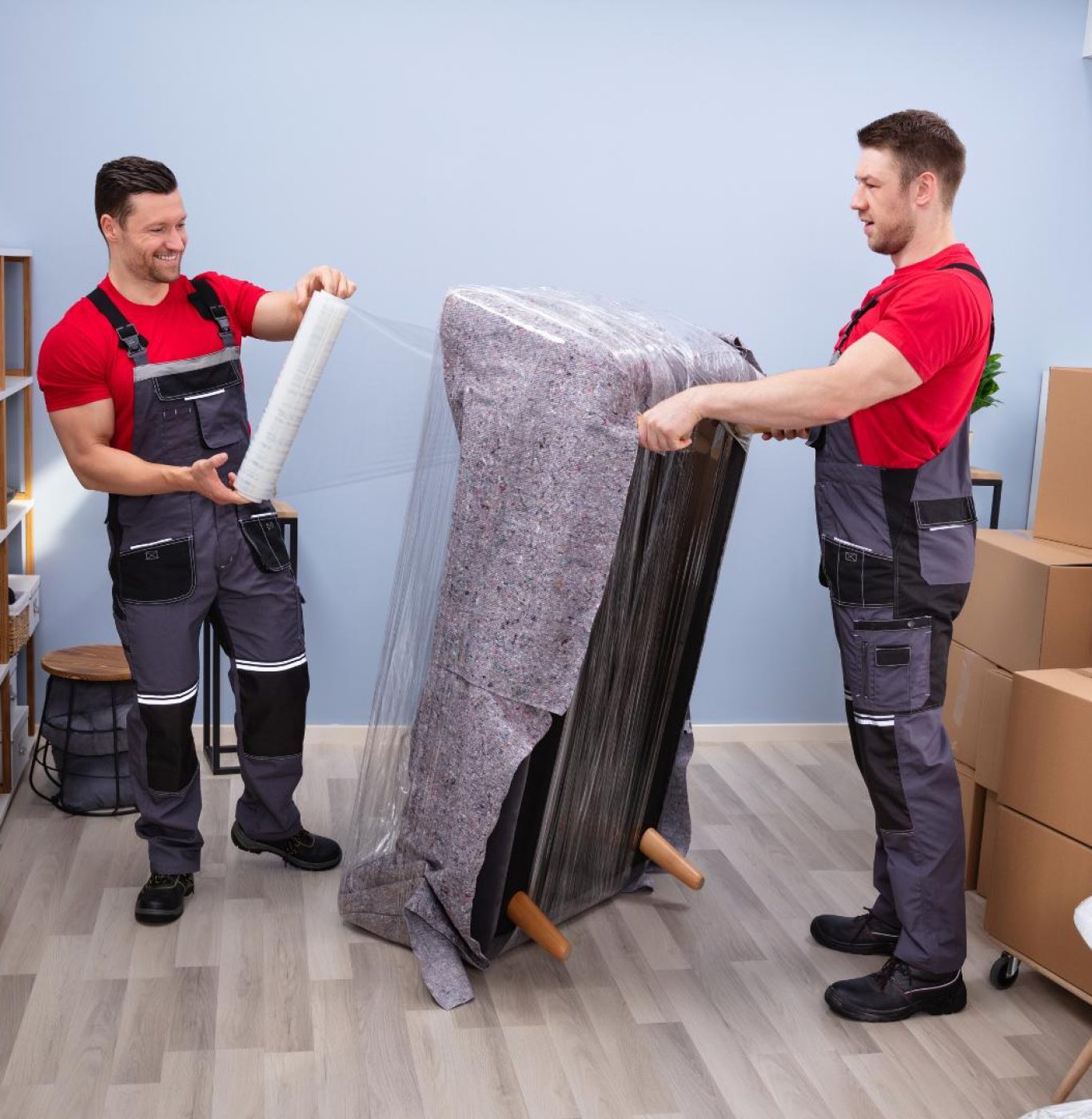 Professional movers near me in La Marque, TX packing boxes and household items carefully