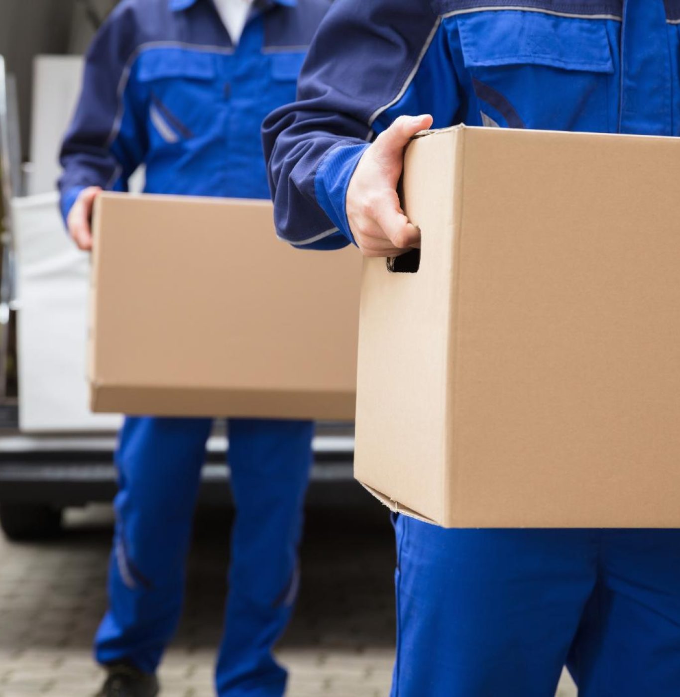 Professional movers near me in Pasadena, TX packing boxes and household items carefully