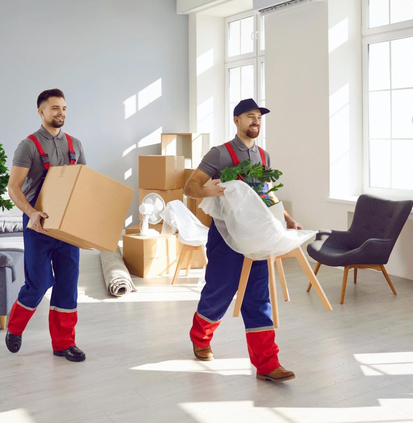 Professional movers near me in Pearland, TX packing boxes and household items carefully