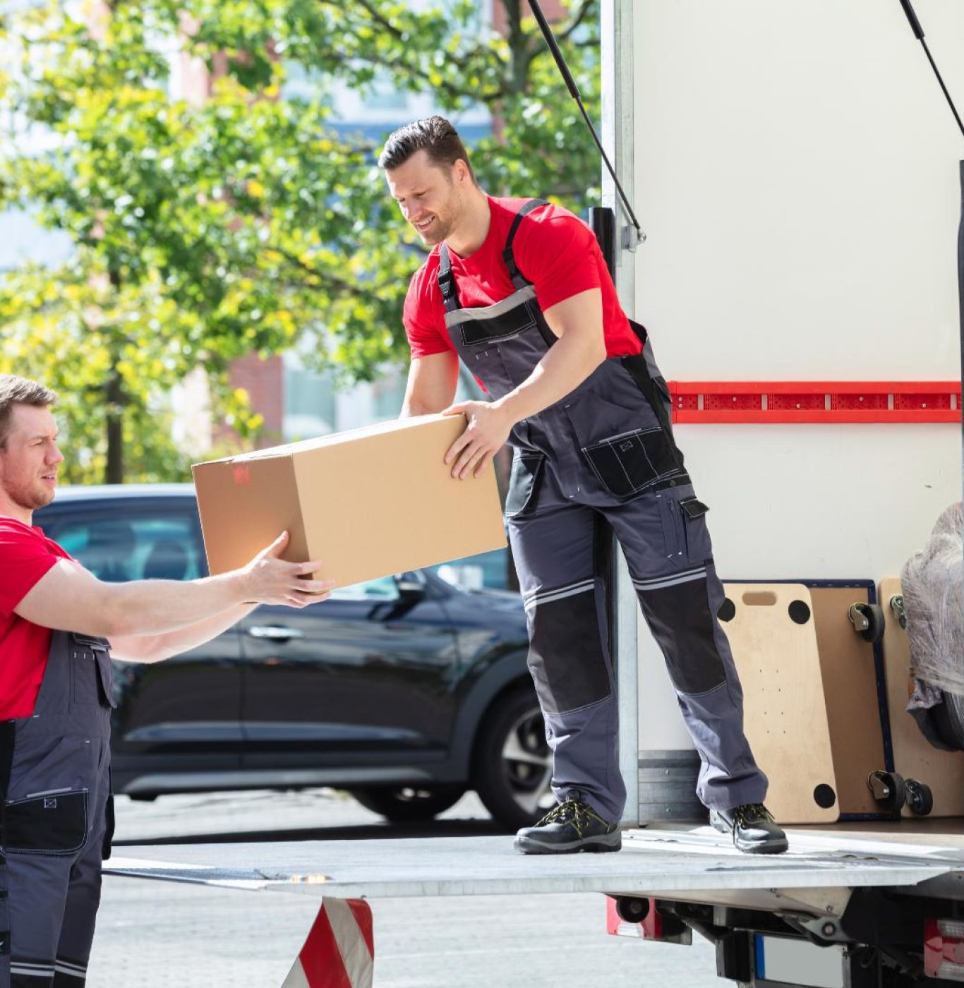 Professional movers near me in Richmond, TX packing boxes and household items carefully