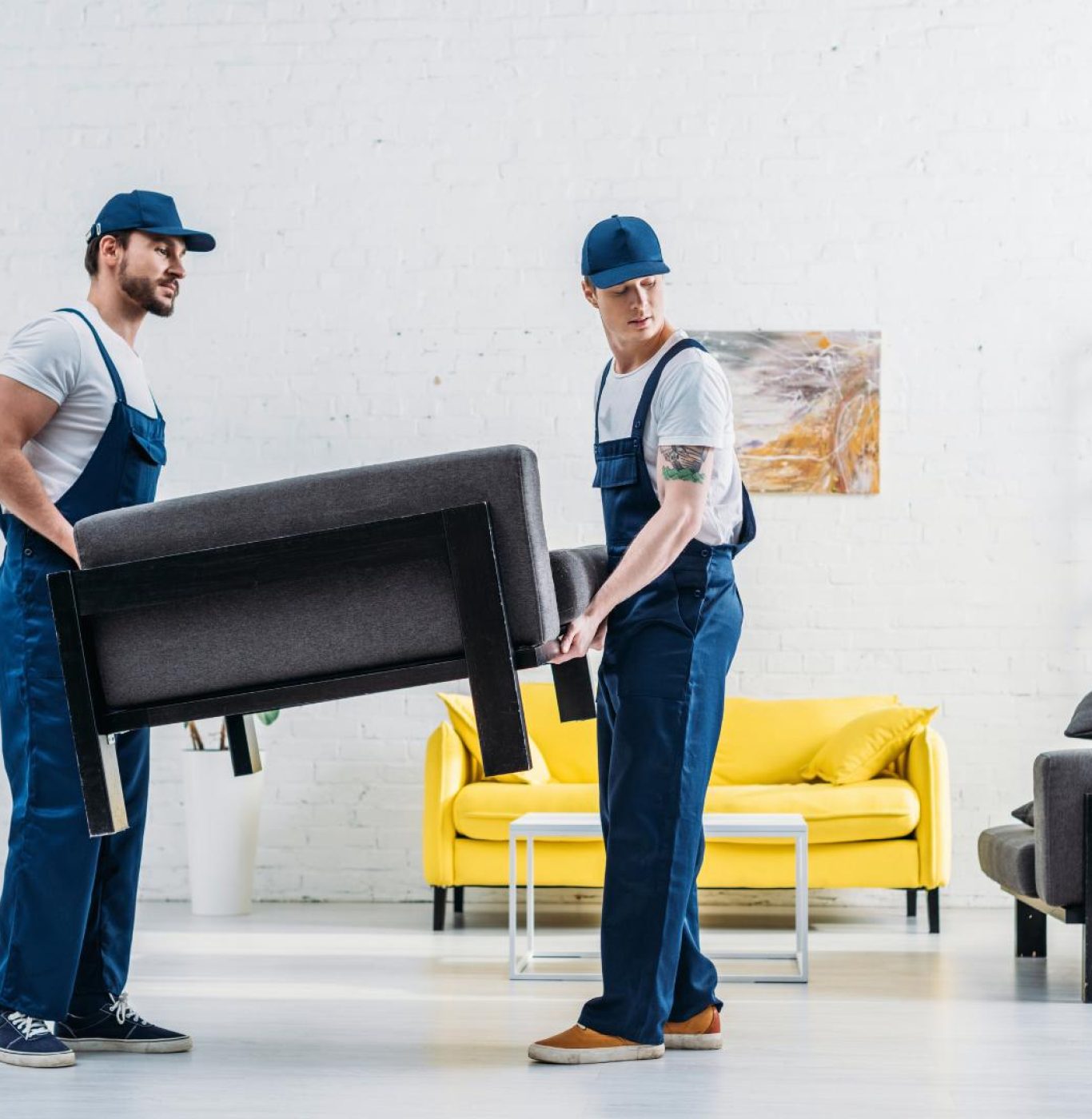 Professional movers near me in Spring, TX packing boxes and appliances carefully