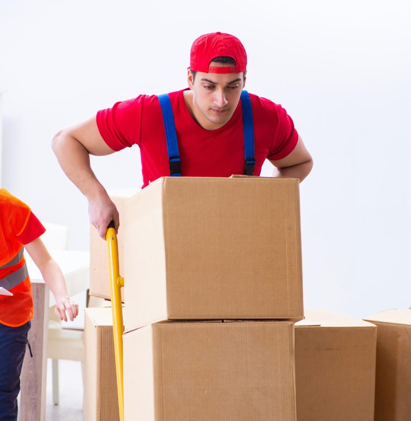 Reliable local movers in Humble, TX carrying furniture during a nearby residential move