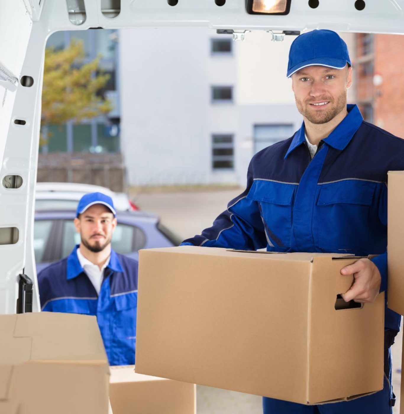 Reliable local movers in Katy, TX carrying furniture during a nearby residential relocation