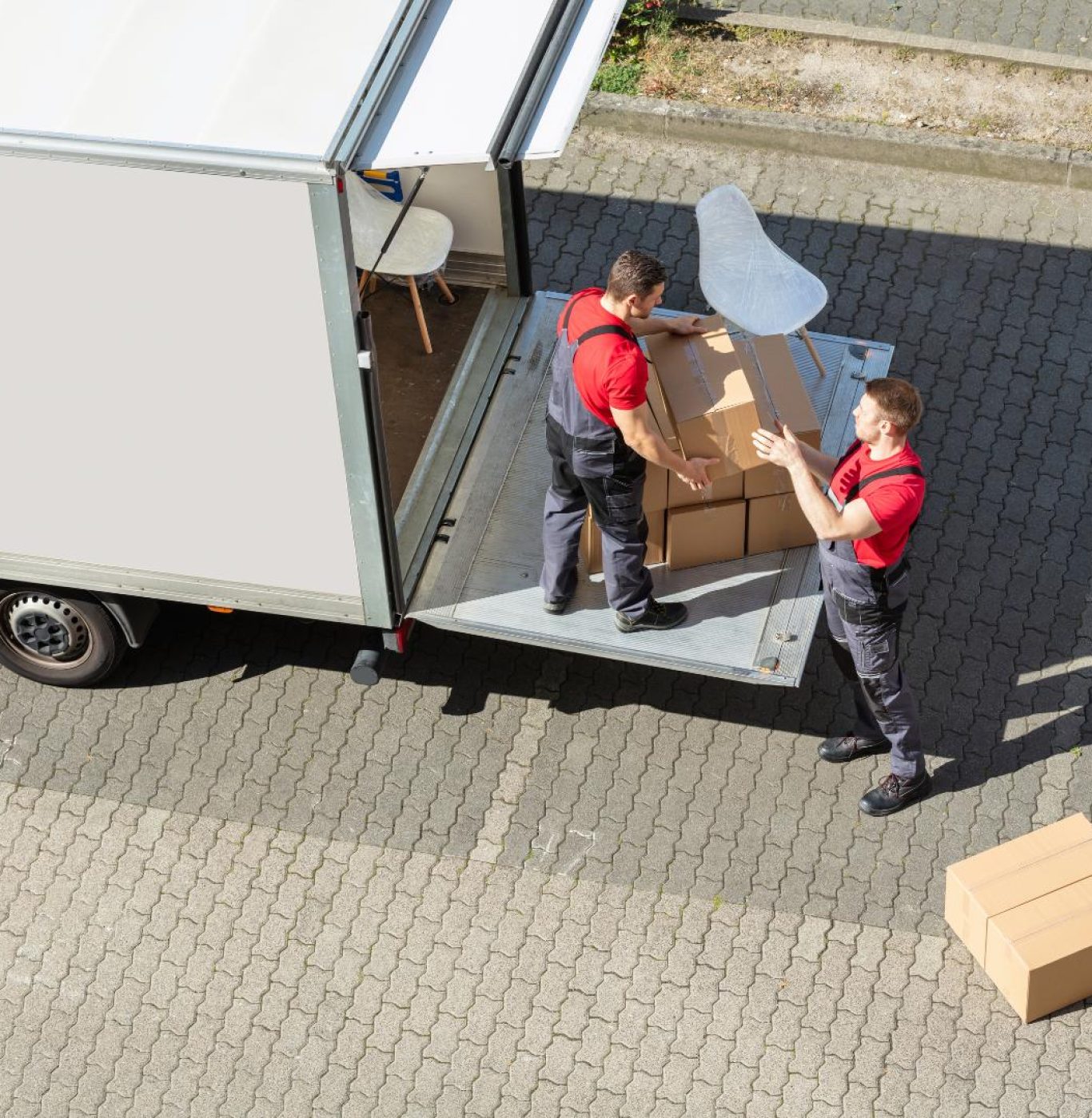 Reliable movers in Baytown, TX loading household furniture for a local move