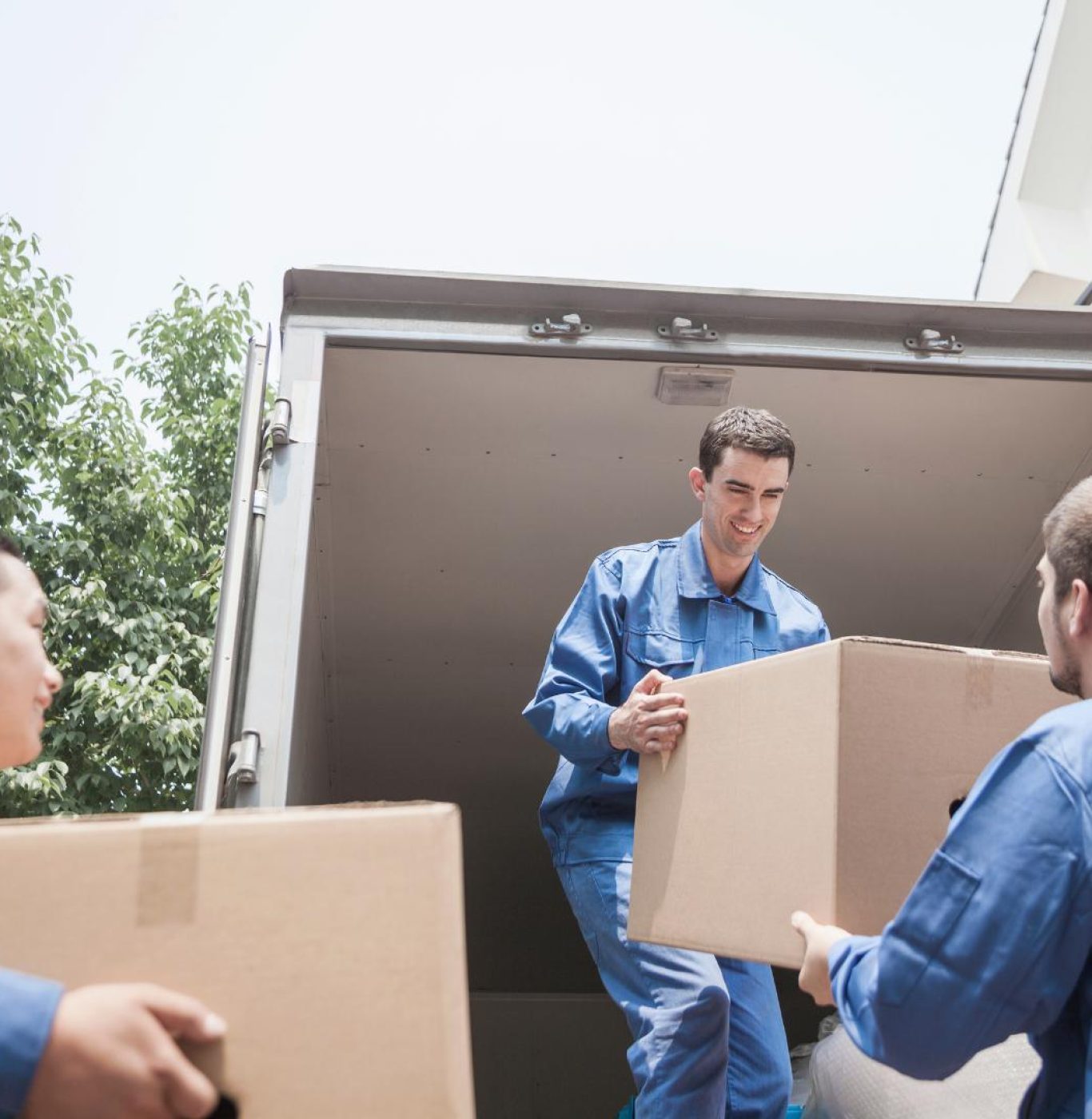 Reliable movers in Dickinson, TX loading furniture for a residential move