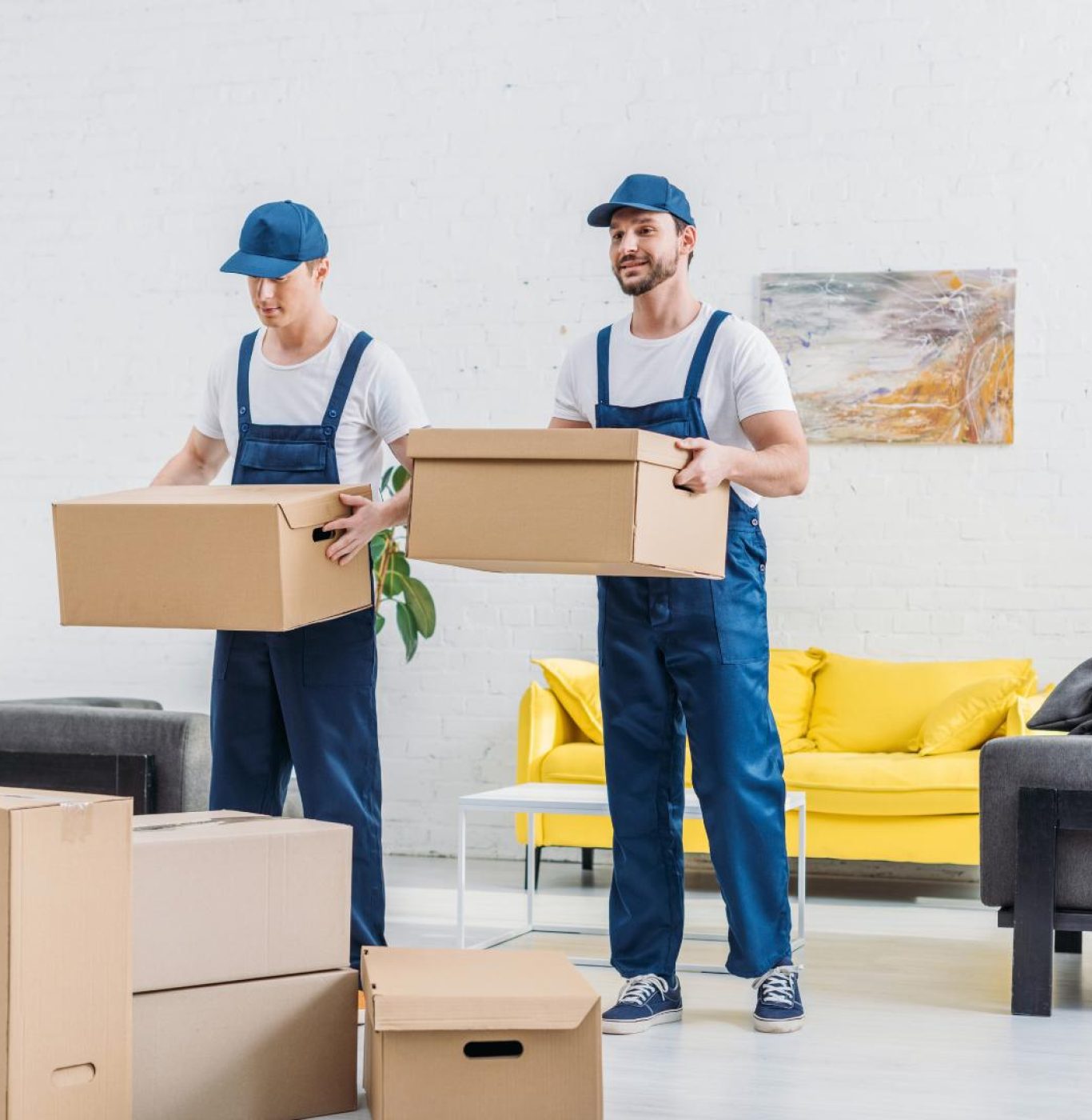 Reliable movers in Spring, TX loading household furniture for a local move
